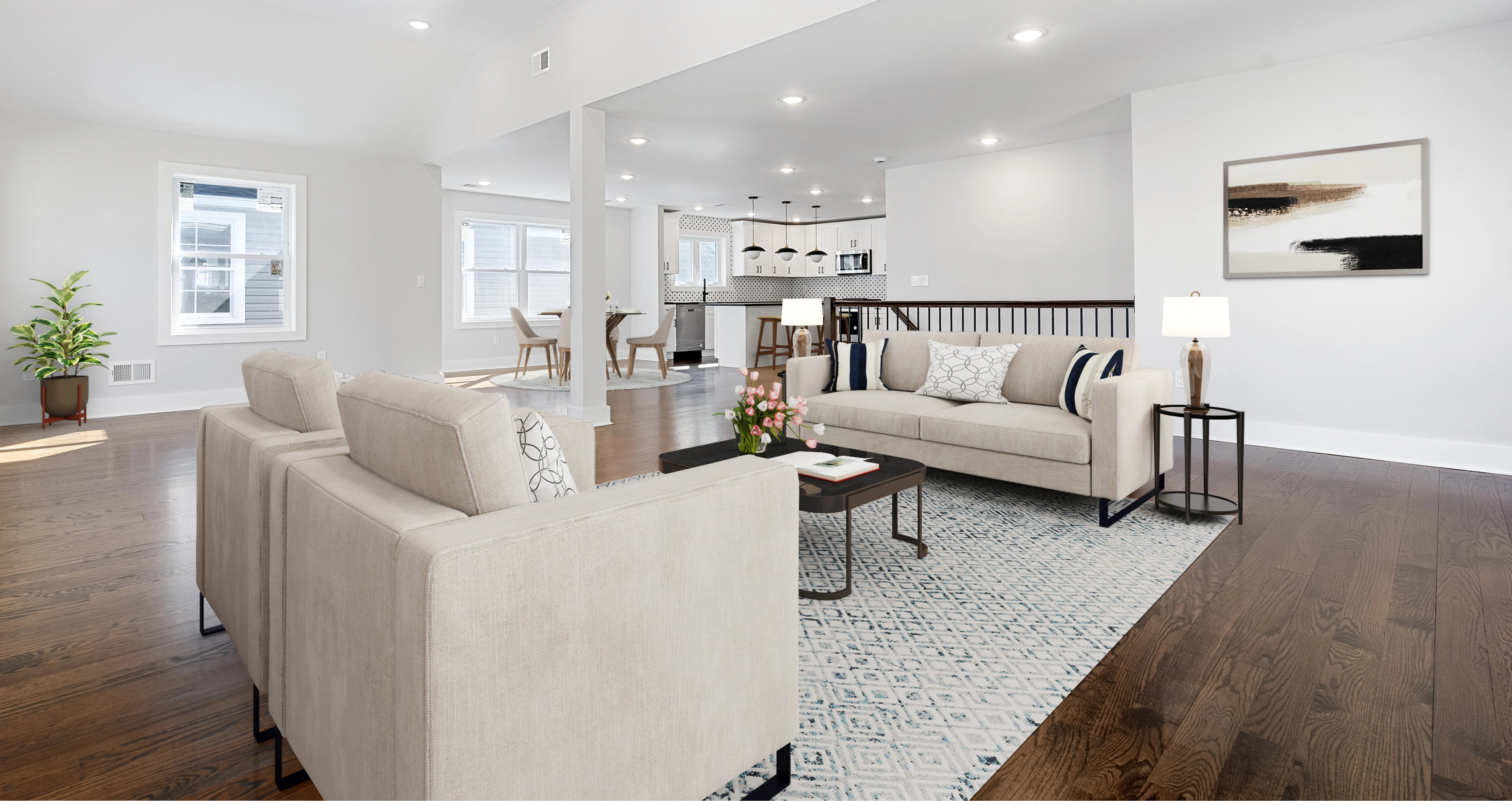 Modern living room with beige sofa, coffee table, and decorative elements.